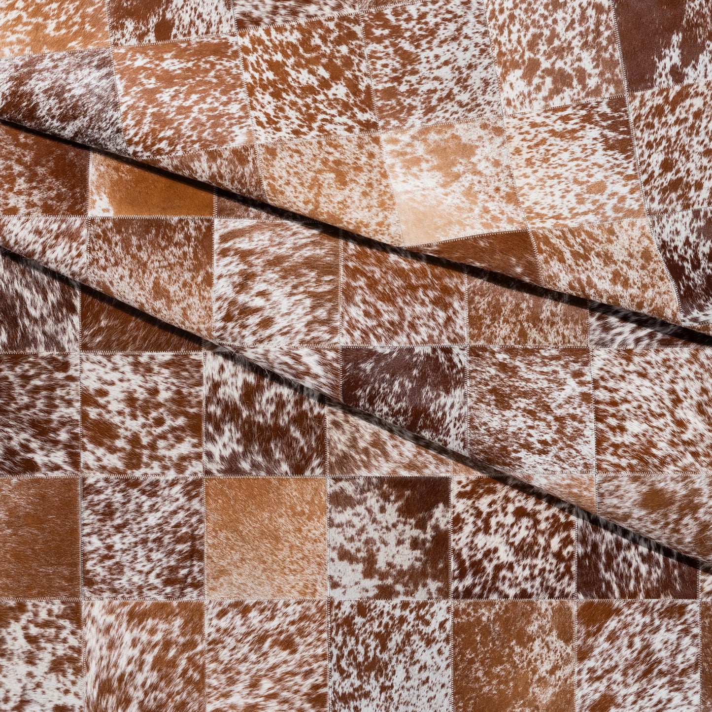 Brown and White Speckled Cowhide Patchwork Rug