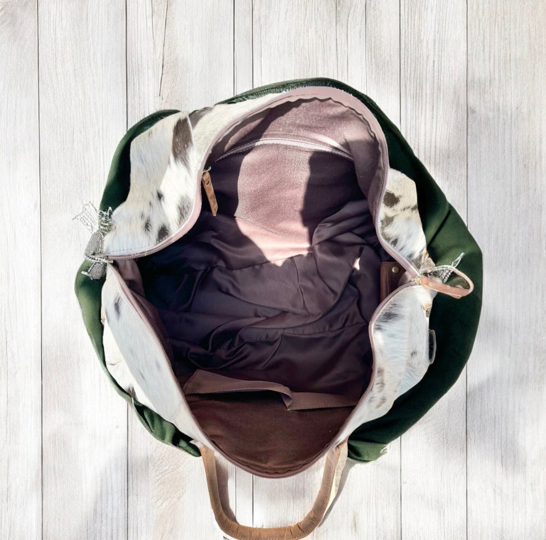 TAN TOOLED LEATHER & COWHIDE DUFFLE BAG