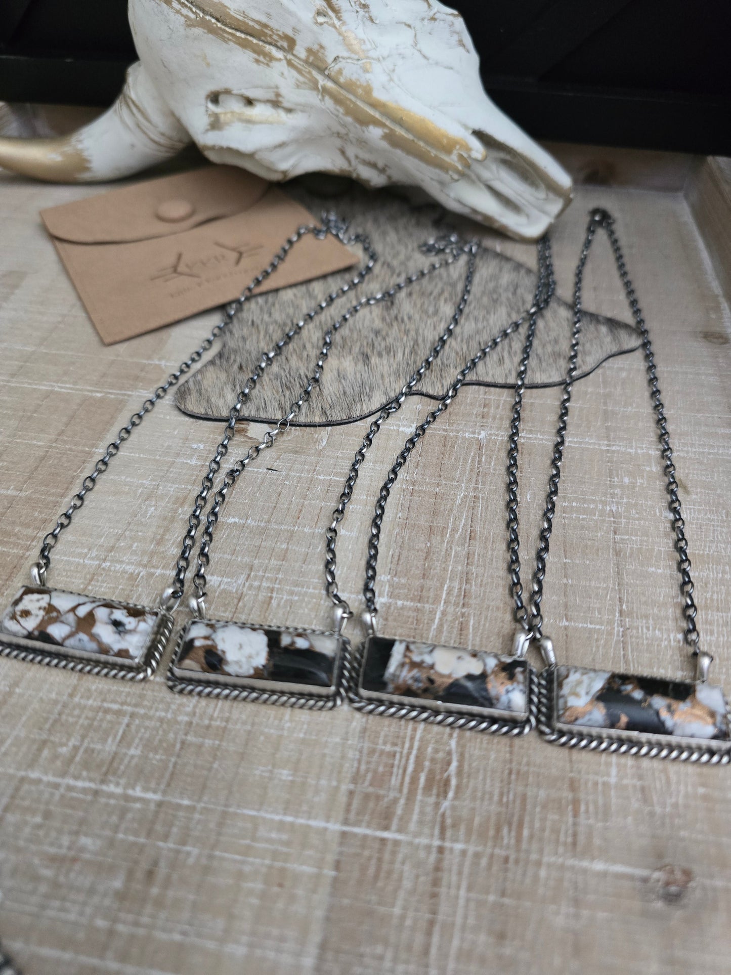 THE AUGUSTINE LARGO WHITE BUFFALO AND BRONZE LARGE BAR NECKLACE