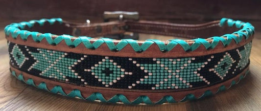 Genuine leather dog collar with teal, white, and black navajo beaded inlay design, a rawhide wrapped edge