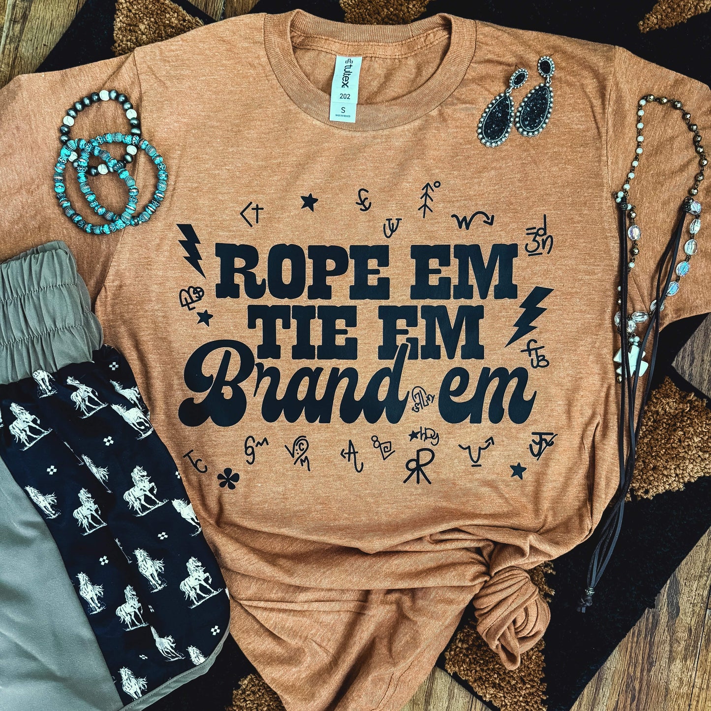 Rope 'Em Tie 'Em Brand 'Em Soft Graphic Tee