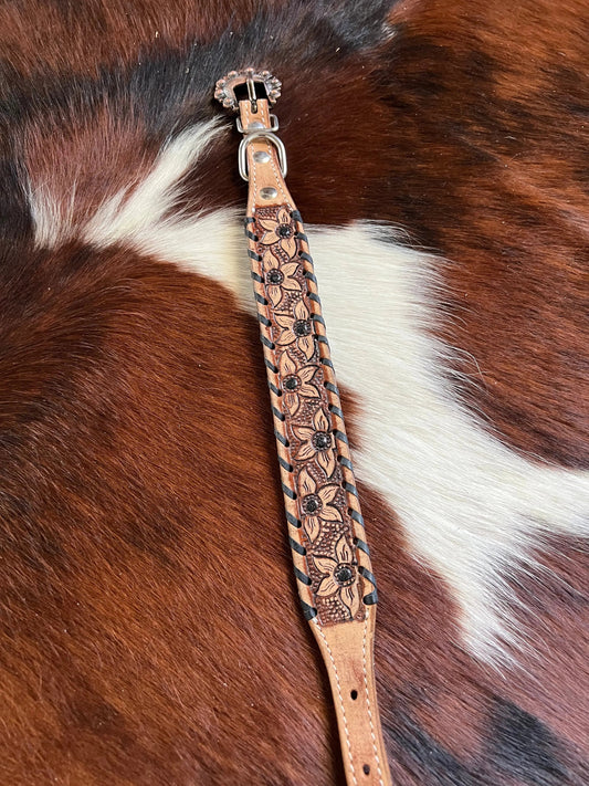 Genuine leather dog collar with black rawhide.
